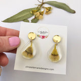 Small tear drop resin dangle with yellow gum blossom