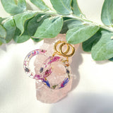 Petite circle flower confetti on gold Huggies
