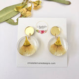 Small round resin dangle with yellow gum blossom and gold top