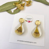 Small tear drop resin dangle with yellow gum blossom