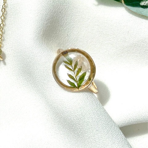 Gold round adjustable size ring with jacaranda leaves