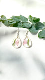 Small tear drop Queen Anne’s lace dangles on hook,