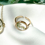 Gold round adjustable size ring with jacaranda leaves