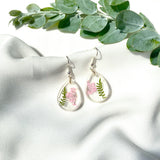 Small tear drop Queen Anne’s lace dangles on hook,