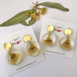 Small round resin dangle with yellow gum blossom and gold top
