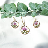 Gold necklace with pink boronia flower