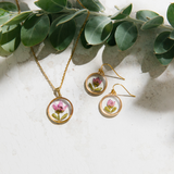 Gold necklace with pink boronia flower