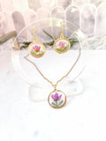 Gold necklace with pink boronia flower