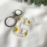 White daisy initial flower confetti key ring