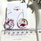 Small round resin dangle with gold hoops