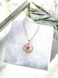 Gold necklace with pink boronia flower