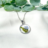 Silver necklace with forget me not flower