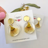 Small round resin dangle with yellow gum blossom and gold top