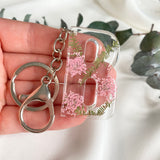 Pink Queen Anne’s Lace initial flower confetti key ring
