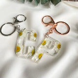 White daisy initial flower confetti key ring