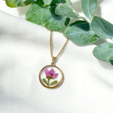 Gold necklace with pink boronia flower