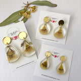 Small tear drop resin dangle with yellow gum blossom